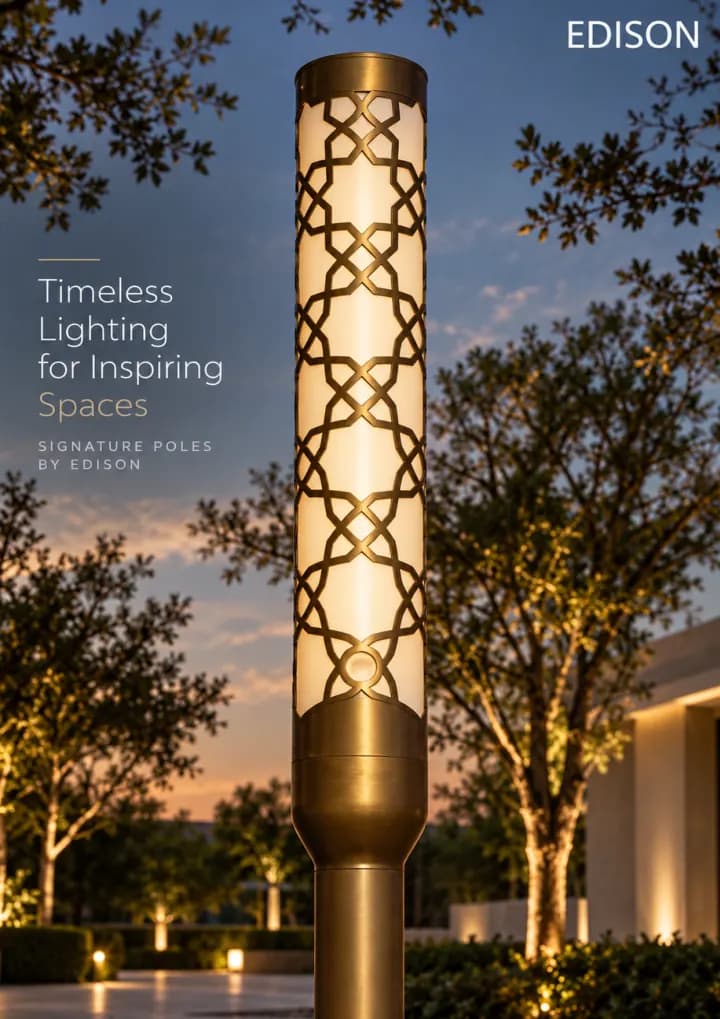 A patterned brass signature pole among trees